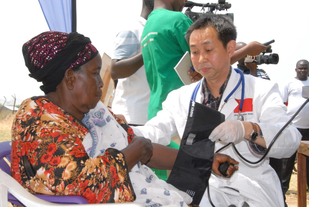 A woman being checked for various ailments during a medical camp in Buhuka, Kyangwali sub-county in Kikuube district. Photo by Robert Atuhairwe.