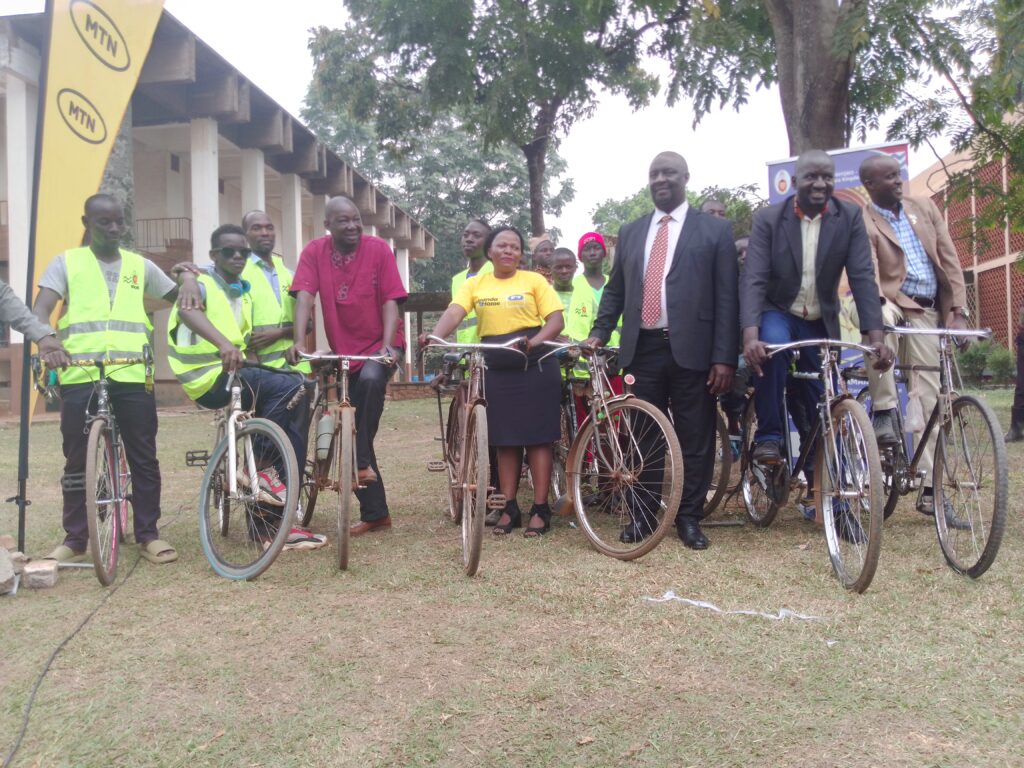 Byakutaga, third right flanked by MTN Uganda, sports and Kingdom officials launch the Masaza cycling competition on July 28 in Hoima City. Photo: Peace Lawrence Ayesigwa.