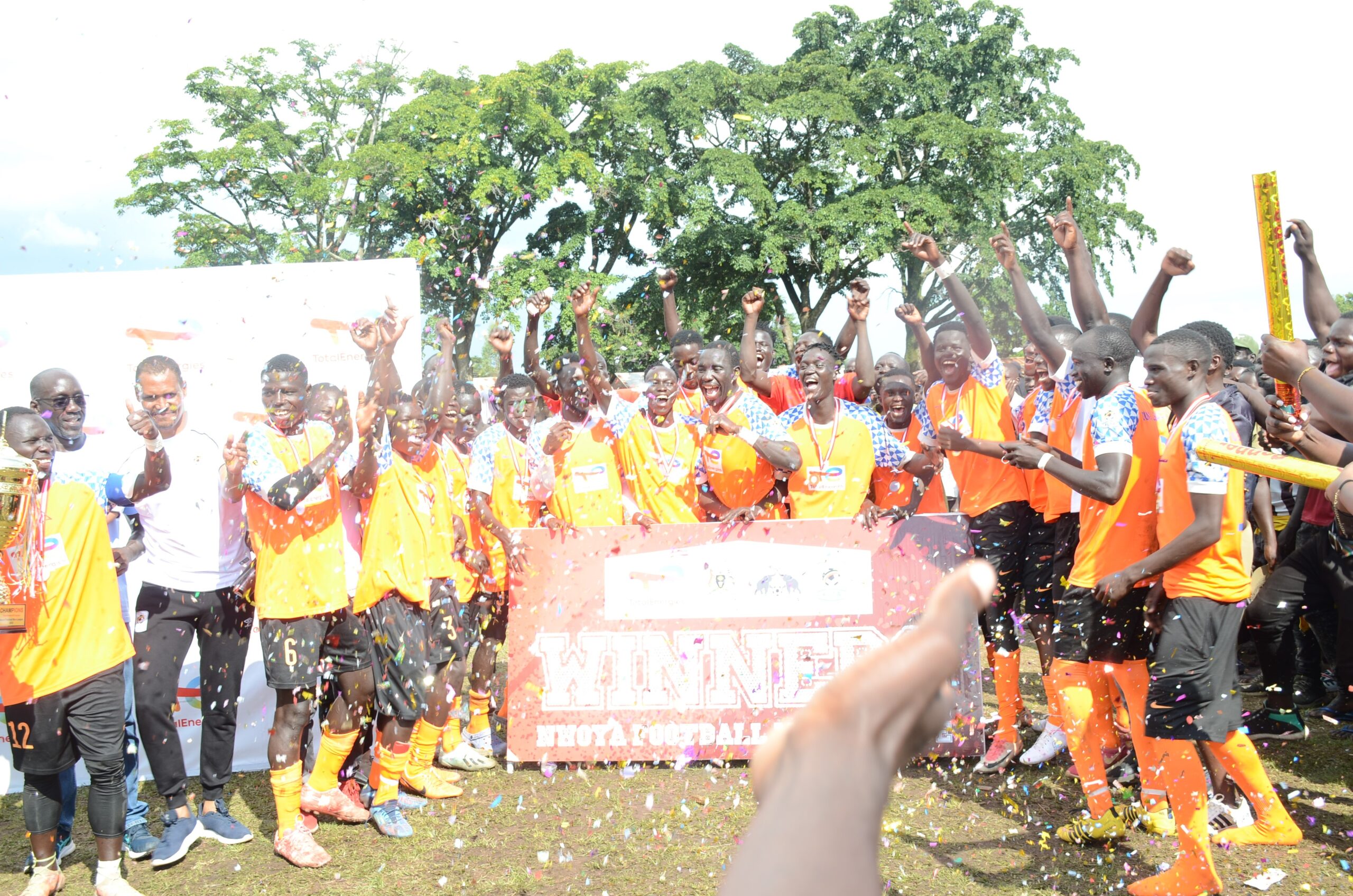 Young Elephant FC players celebrating after beating Black Black Tiger Wilacic FC at Anaka Primary school playground in Nwoya district on Saturday.