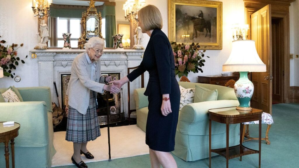 Britain's Queen Elizabeth II, left, welcomes Liz Truss during an audience at Balmoral, Scotland, where she invited the newly elected leader of the Conservative party to become Prime Minister and form a new government, Tuesday, Sept. 6, 2022.