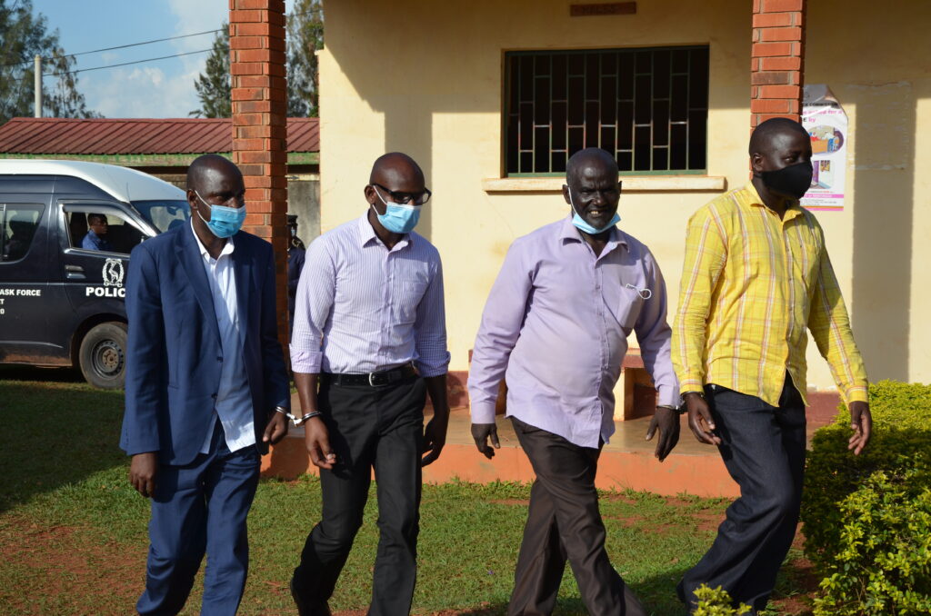 L-R, Hoima district chairperson Kadiri Kirungi his Vice Benson Chiche, Jackson Mulindambura the secretary for production and Geoffrey Komaketch secretary finance when they last appeared before court in Hoima on September 7, 2021. Courtesy Photo.