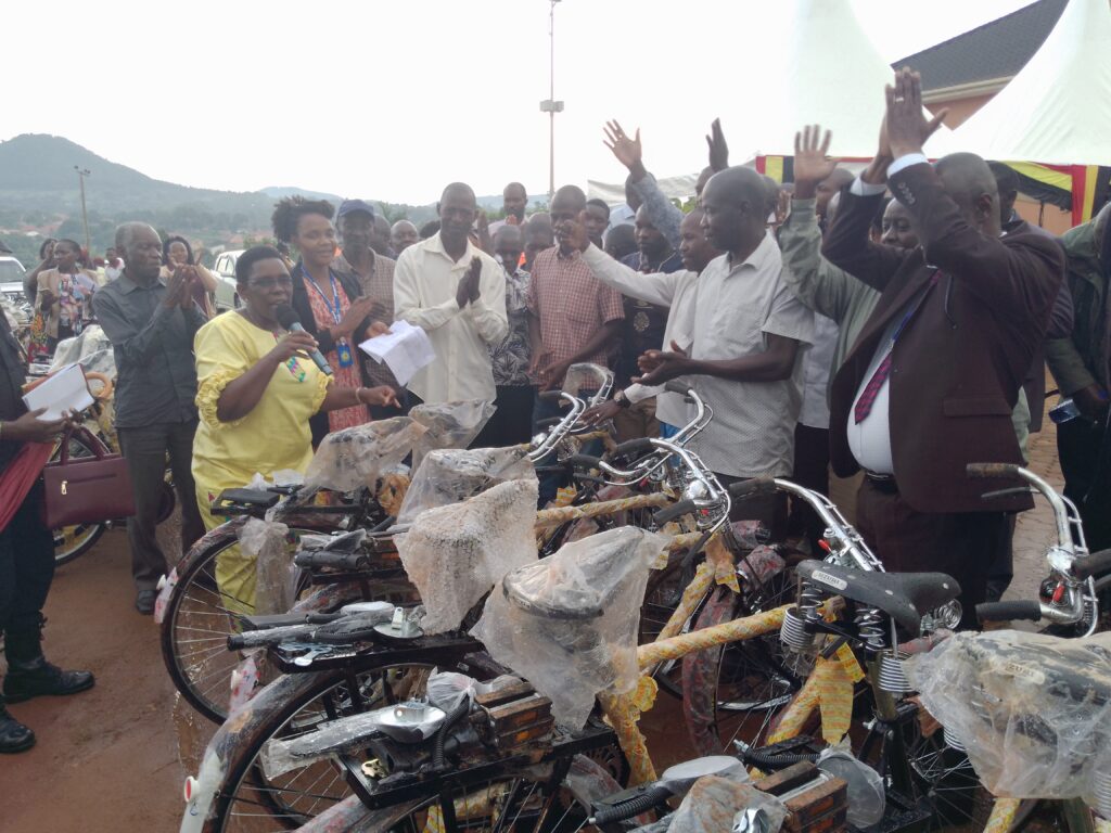 Mary Mugasa, the state minister for Public Service flagging off the distribution of bicycles to LCIs in Hoima City on Friday. Photo by Peace Lawrence Ayesigwa.