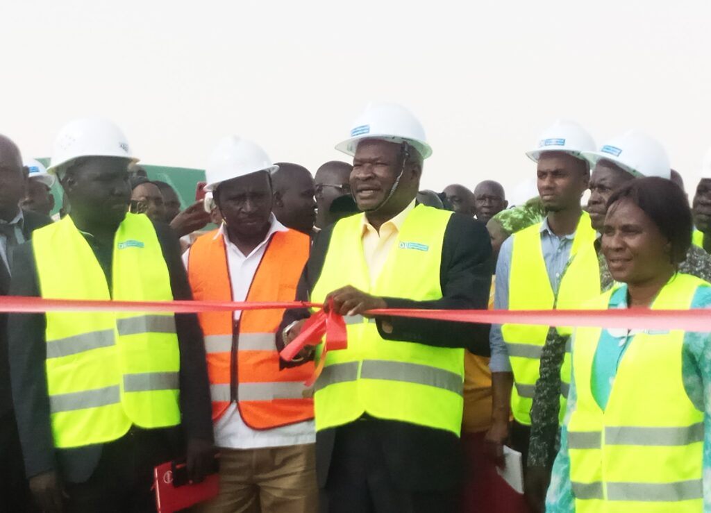 State Minister for lands, Obiga Kania cuts a ribbon to launch the construction site of the district Administration block last week. Credit: Federick Dramadri/The Albertine Journal