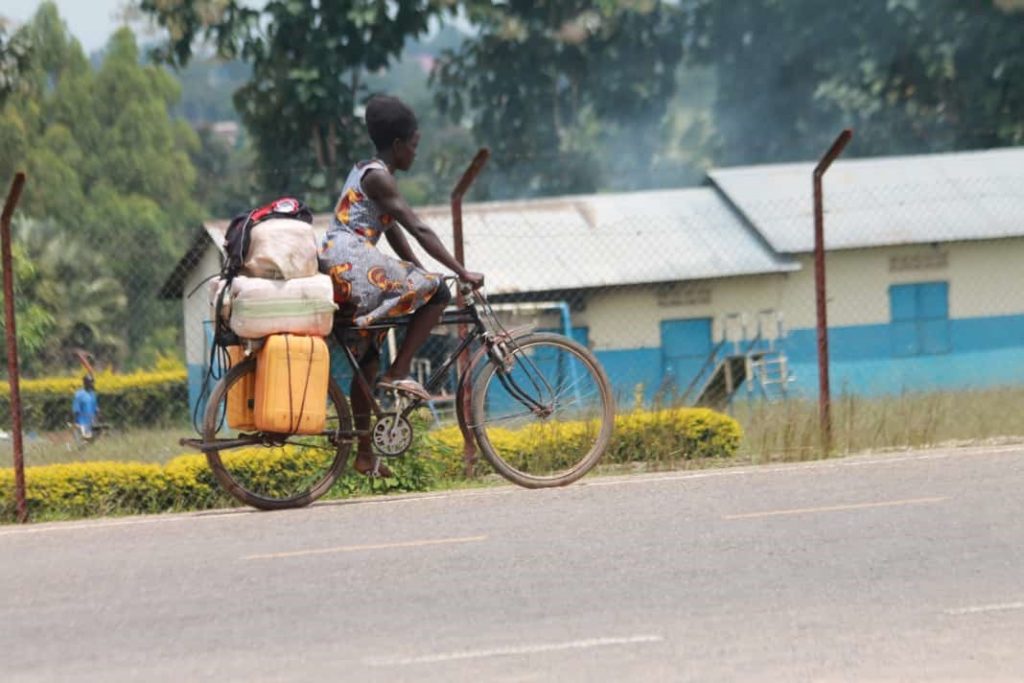 A suspected fuel smuggle riding with petrol in Jerrycans along Ediofe stretch from DR Congo.