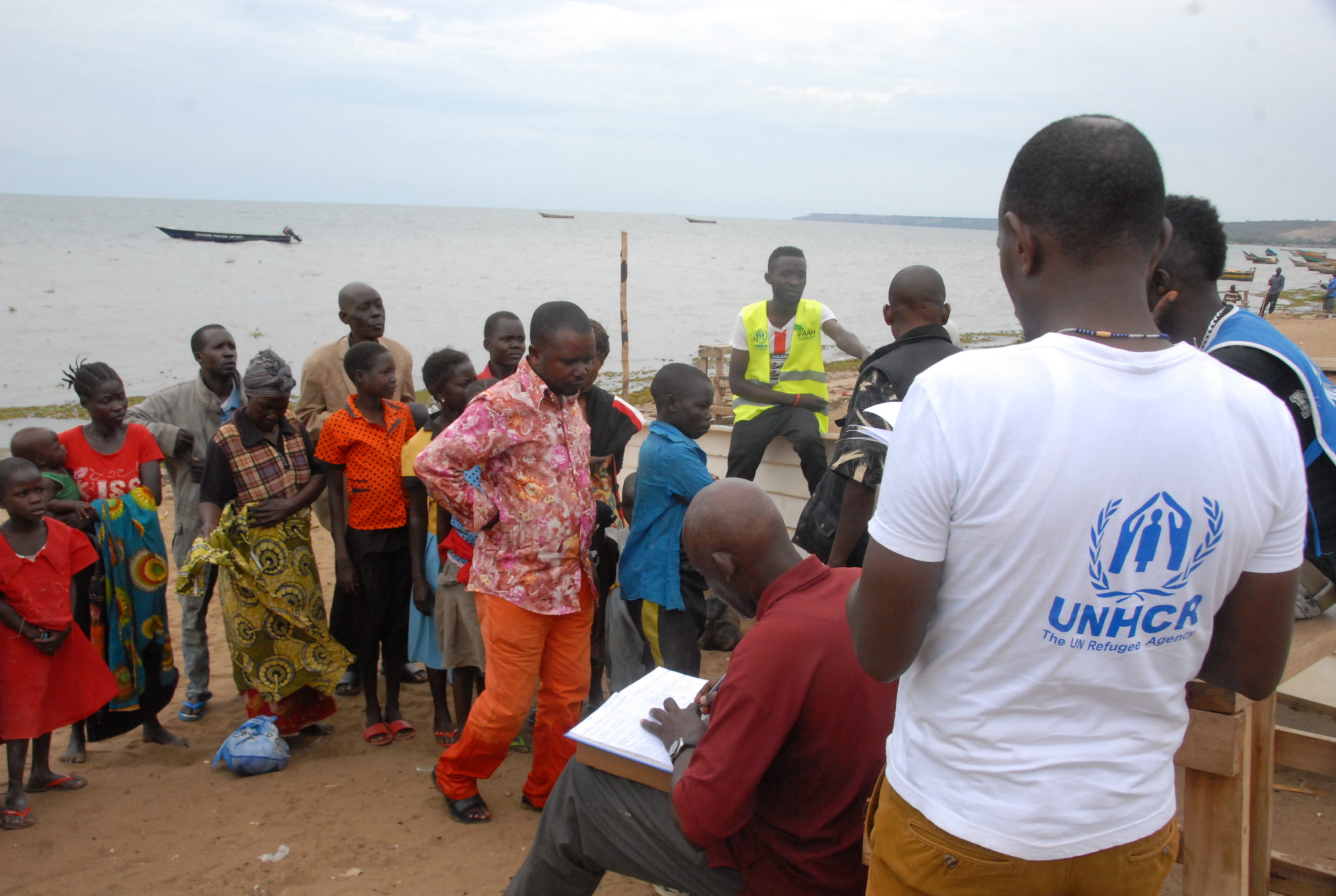UNHCR-Officials registering refugees who had-come from DR Congo via Lake Albert at-Sebagoro-landing site in Kikuube district in Western Uganda in 2018. Photo: Robert-Atuhairwe/The Albertine Journal.