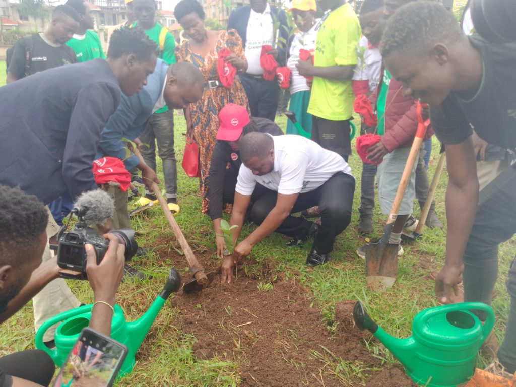 Hoima City-Mayor Brian Kaboyo plants a tree during the launch of the greening campaign on November 2. Photo by Peace Lawrence Ayesigwa/ The Albertine Journal.