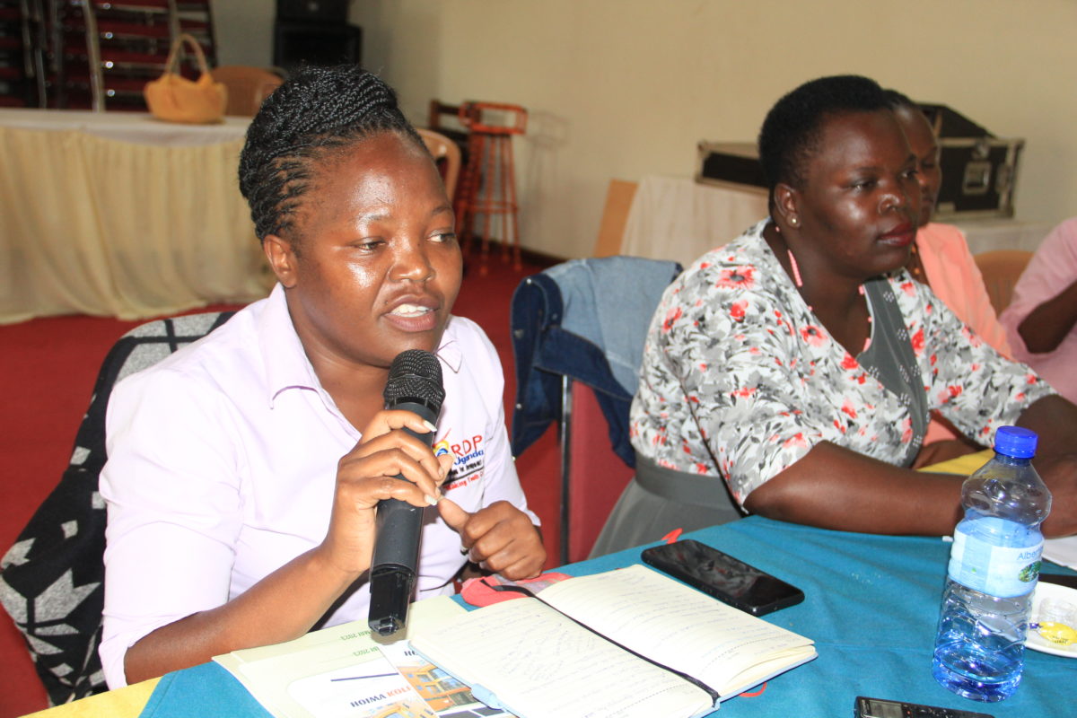 Barbra Anyango Wabwire, a monitoring and evaluation officer at the Recreation for Development and Peace speaks during the event at Kolping Hotel in Hoima City. Photo: Robert Atuhairwe.
