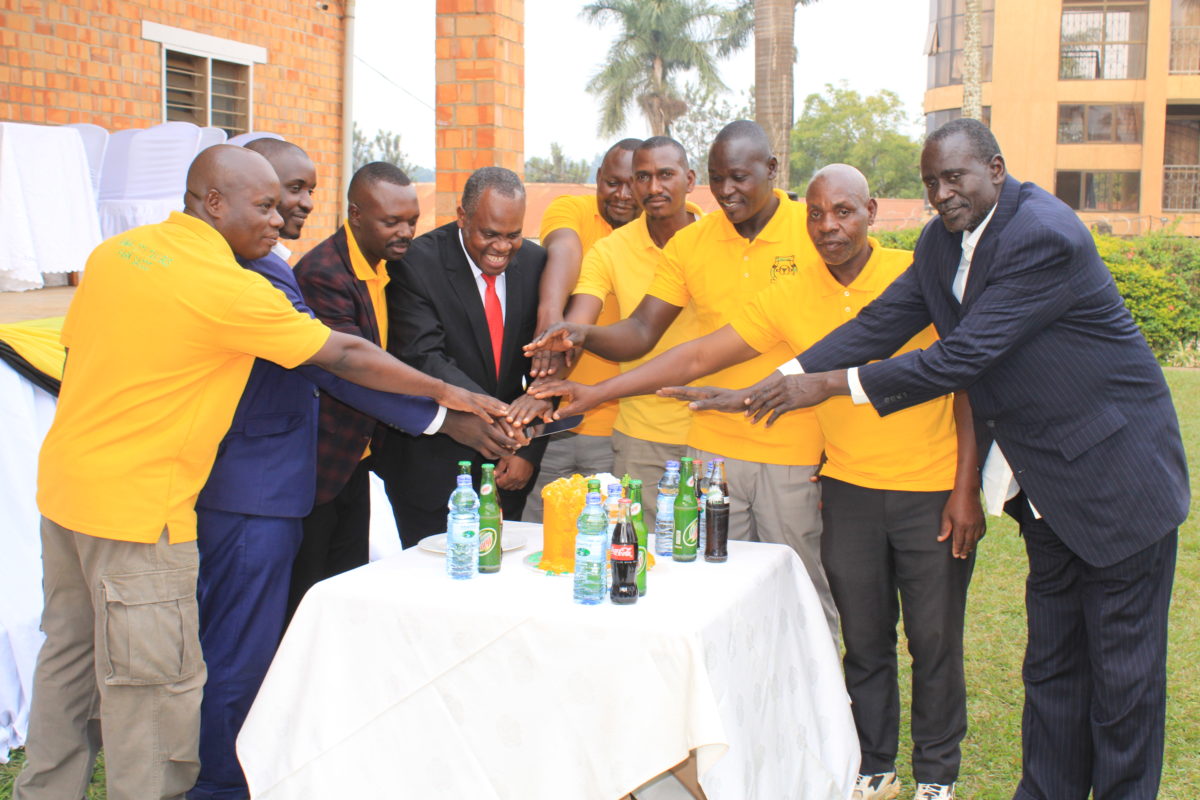 Members cut a cake during the launch of the Hoima City Tax and Bus Park Drivers SACCO on December 31, 2023, at Kolping Hotel Gardens. Photos: Robert Atuhairwe/The Albertine Journal.