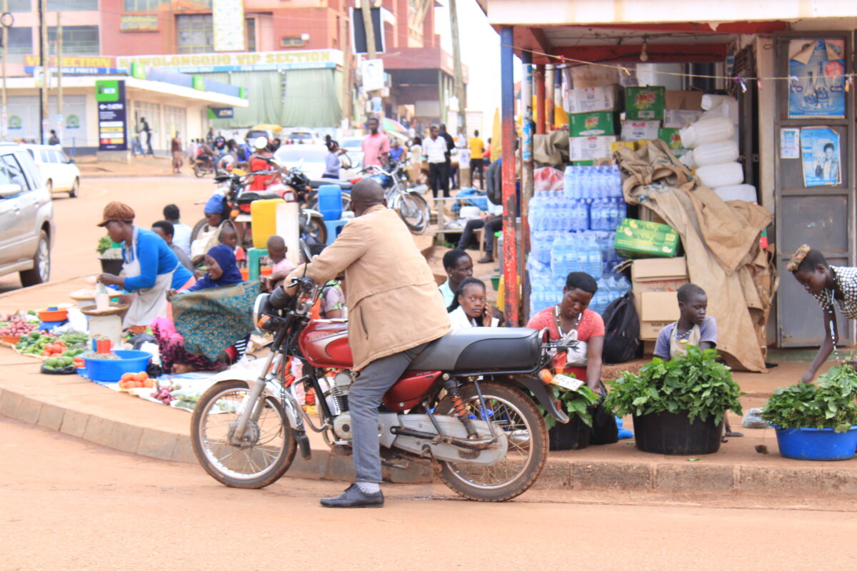 Life's hustle on the sidewalks, where vendors bring flavours to the streets, while authorities look on. Credit: Robert Atuhairwe/The Albertine Journal
