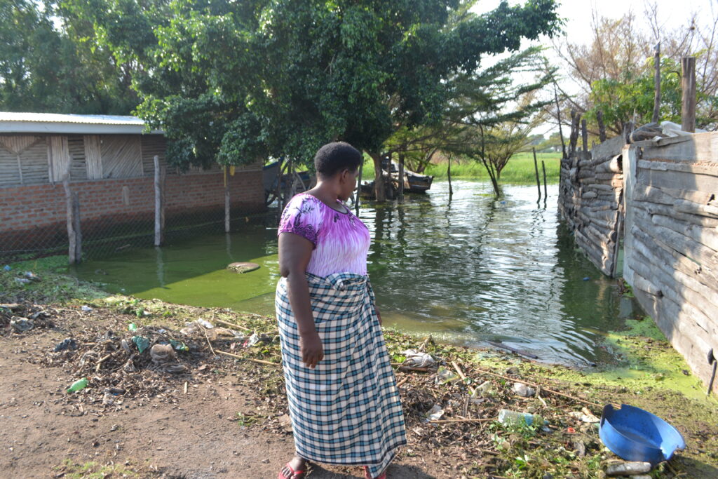 A woman looks at her house that was affected by floods near Wanseko landing site in Buliisa district, Western Uganda. Credit: Robert Atuhairwe/The Albertine Journal