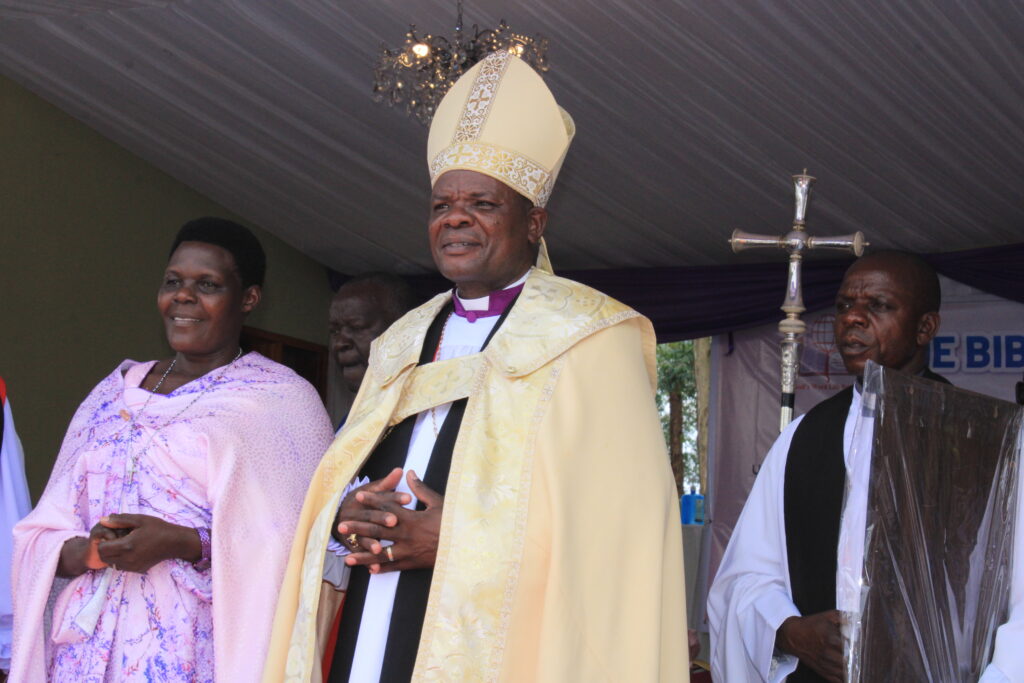 Bunyoro-Kitara Diocese Bishop Rev. Canon. Jacob Ateirweho flanked by his wife, Irene Kobusinge. Credit: Robert Atuhairwe/The Albertine Journal