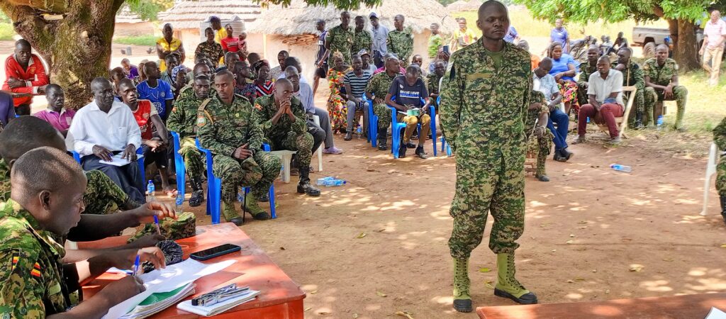 Sergeant (Sgt) Godfrey Kisembo (standing) before he was sentenced to one year and 11 months in prison for illegal possession of ivory. Photo/Wilfred Okot/The Albertine Journal.