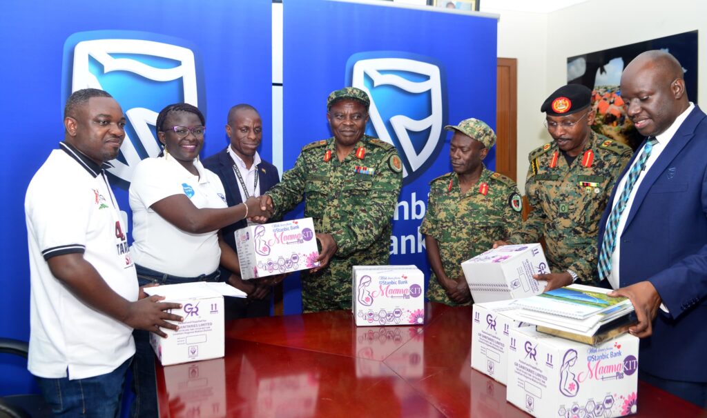 Diana Ondoga (second left) handing over a Mama Kit to Brig Gen Michael Kibuye at the Ministry of Defence Headquarters in Mbuya over the weekend. Credit: Courtesy.