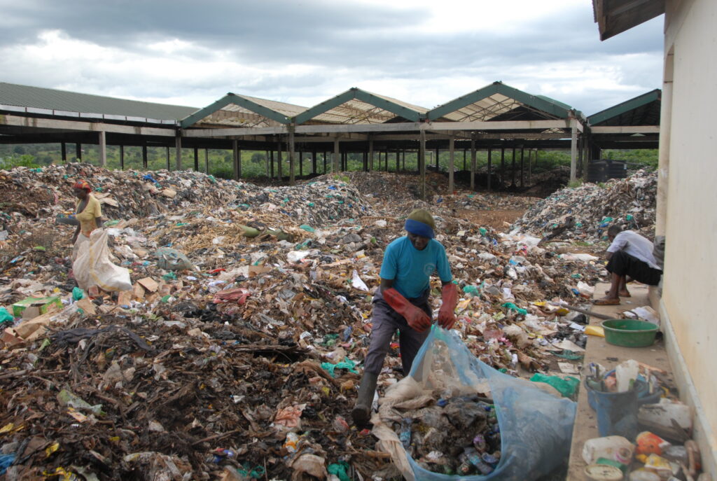 The waste composite plant at Kibati Cell in Hoima City whose courtyard has been over flooded with garbage. Credit: Robert Atuhairwe/The Albertine Journal.